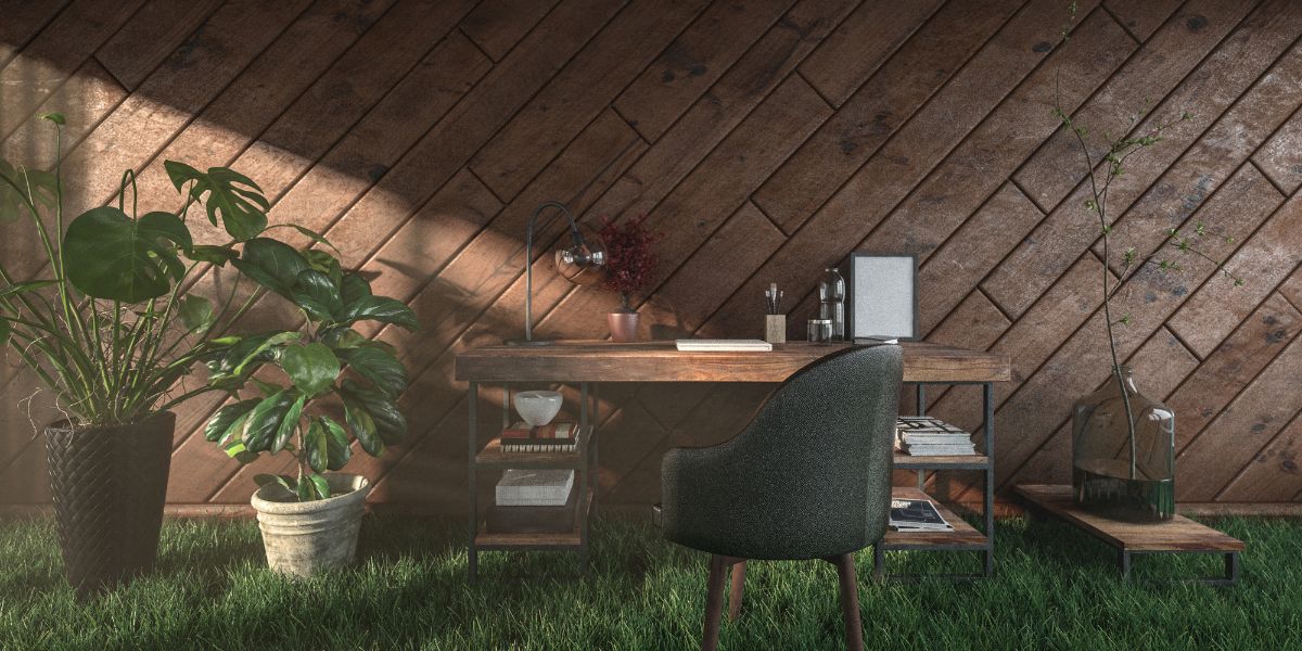 Eco-friendly home office with wooden desk, indoor plants, and grassy floor against a wooden wall sustainable real estate